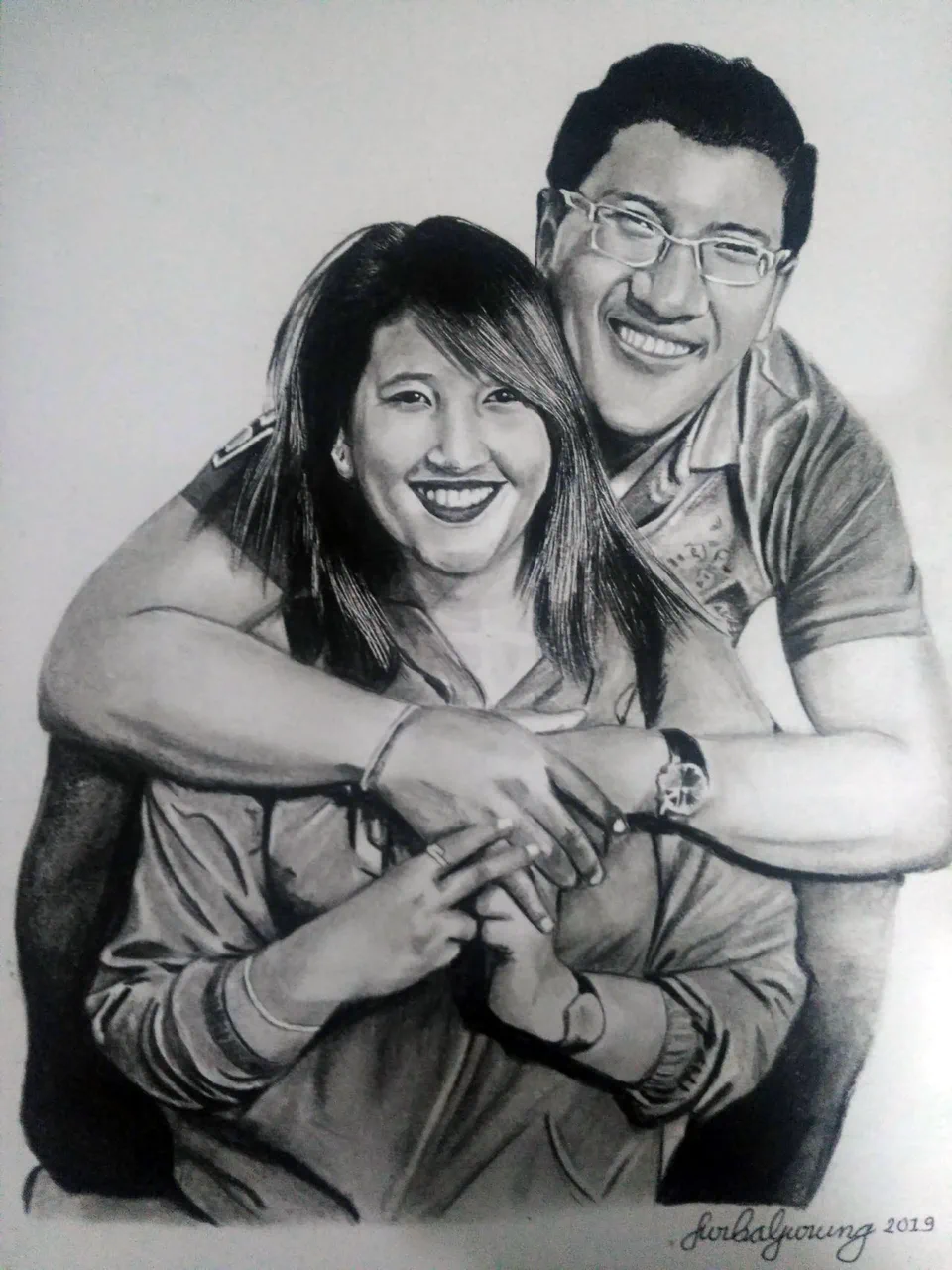 Graphite portrait of a smiling Nepali couple embracing.